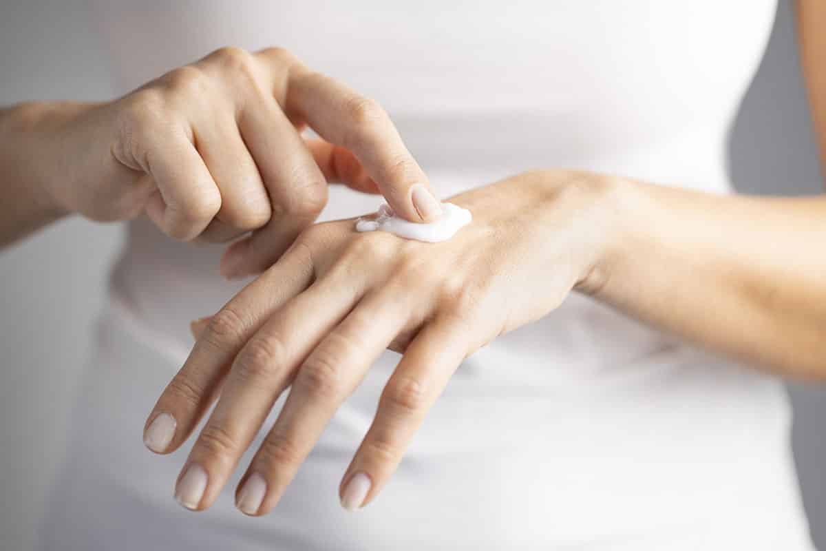Woman managing dry hands.