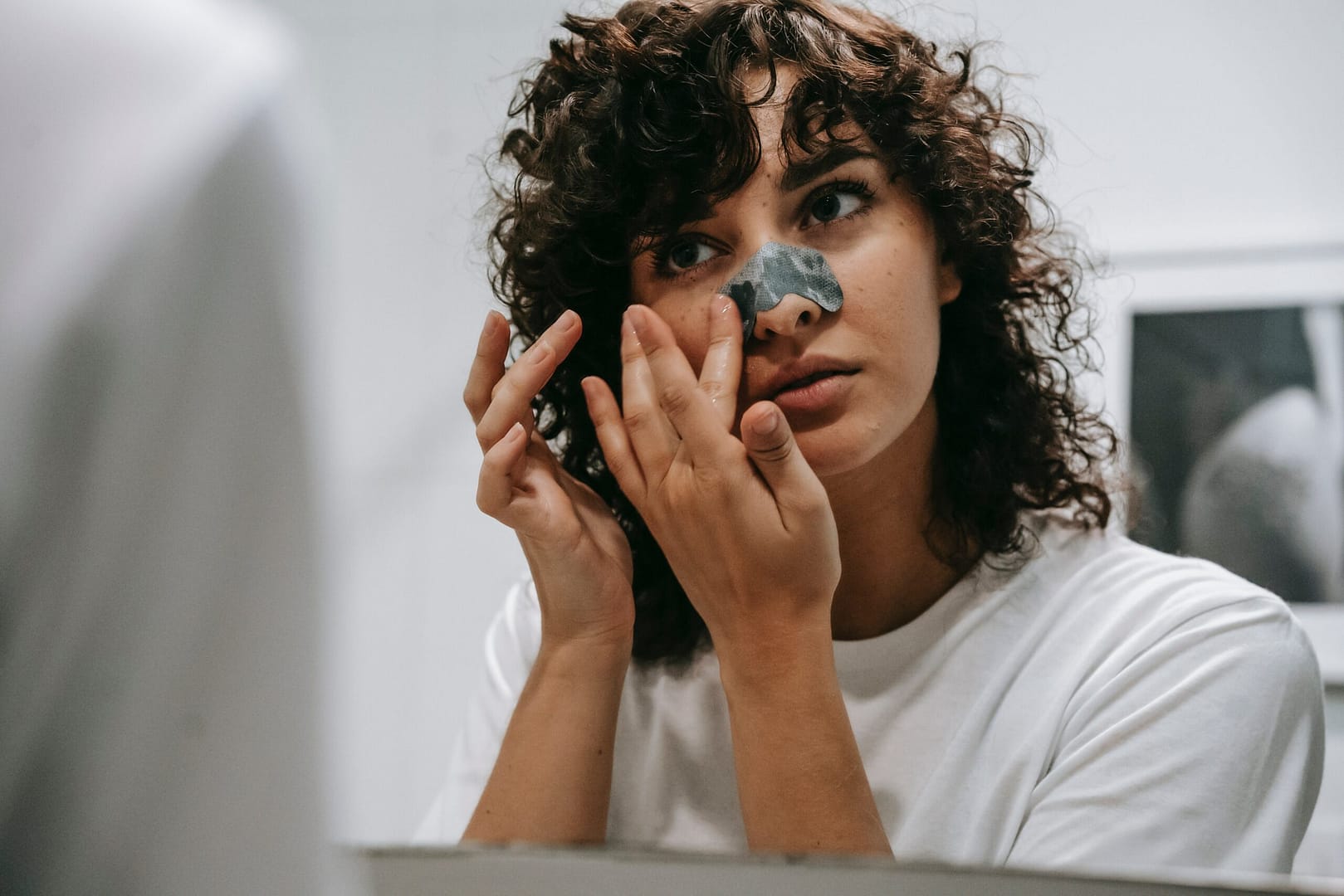 Woman treating blackheads
